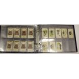 Album containing approx 42 cards issued by Faulkner, mixed condition, high cat value, needs viewing