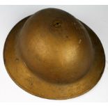 British WW1 Brodie helmet, no liner or chin strap, painted gold. Maker marked