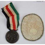 German / Italian Afrika campaign medal, maker marked, plus a faded cloth Afrika Korps badge, GVF