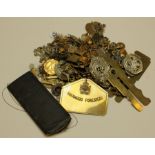 Cap badges - tin packed full of old cap badges, pin badges, button cleaners, bed plate, etc and a