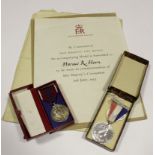ERII Coronation medals in boxes with award scroll and addressed envelope to Horace R Horn from