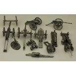 A collection of pewter (?) models of many different types of 19th century cannon. These are finely