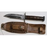 A U.S. Jet Pilots knife of the pattern used in Vietnam in the 1960s. A well used example. Bowie