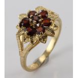 9ct Gold Garnet set floral style Ring size K weight 2.7 grams