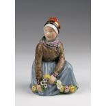 Royal Copenhagen figurine, no. 12413 (Fano /Faro), depicting a girl picking flowers, height 14cm