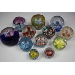 Twelve glass decorative paper weights