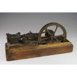 Live steam stationary engine with single flywheel, mounted on a wooden plinth, total height 16.5cm