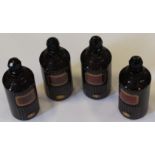Apothecary. Four Purple glass apothecary jars / bottles, with stoppers and labels