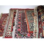 Five Persian / Iranian prayer rugs, 70cm x 240cm approx. and smaller