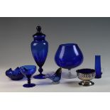 Seven pieces of blue glass, including bowls, paperweights, ornaments etc.