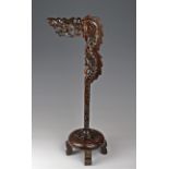 Chinese carved hardwood lantern stand in the form of a dragon, height 67.5cm approx.