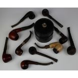 Pipes. A group of ten pipes, including a Peterson's System, etc., together with a leather tobacco