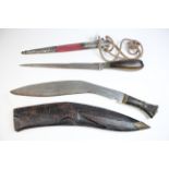 Dagger: An Indian Dagger 'KARD'. Large bulbous horn grip. Slim blade 12". Eastern silver mounts.