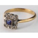 18ct Gold Ring square set with a central Sapphire surrounded by Diamonds size O weight 2.8 grams