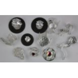 Eleven crystal ornaments, including Swarovski, depicting Clams, a Swan, a Seal etc.