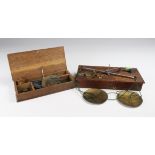 Set of coin scales, circa early 20th century, with eleven weights, contained in original oak case,