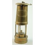 Miners Lamp. An original brass 'E. Thomas & Williams Ltd, Aberdare, Wales' miners lamp, height 24.