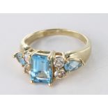 9ct Gold QVC Ring set with Blue Topaz and CZ size L weight 3.6 grams