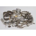 Mixed assortment of silver / white metal items to include bracelets, chains, napkins rings etc