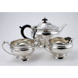 Silver three piece tea and set by William Neale & Son Ltd, comprising teapot, cream/milk jug and