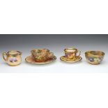 Four hand painted miniature Royal Worcester items, comprising cup & saucer, signed Freeman; cup &