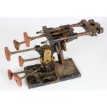 An unusual cast iron stand with six knobs for altering position (possibly used for a camera), base