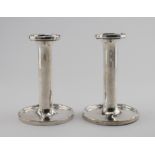 Pair of silver candlesticks, hallmarked 'Birmingham 1945' (rubbed), weighted bases, height 12.2cm