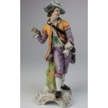 Dresden figure of a man by Helen Wolfsohn, AR monogram, 22.5cm, chipped and repaired.