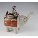 Chinese clay teapot, depicting an elephant being ridden by a Chinese gentleman, circa late 19th to