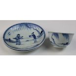 Chinese blue and white, two small dishes and a tea bowl decorated with figures.