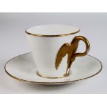 Cup and saucer set, circa 1875, cup with gilt handle in the form of a crane, diamond mark to base of