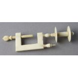 Cotton bobbin clamp, circa late 19th century, height 10cm approx.