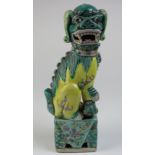 Burmese (?) green and yellow pottery standing dog figure 23.5cm tall.