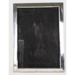 Large silver photograph frame hallmarked for Birmingham, 1915 (Maker rubbed). Has a wooden back with