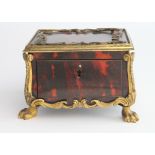 Tortoiseshell cosmetics or apothecaries box 10cm wide, gilt metal decoration, and two surviving jars