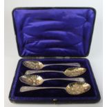 Set of four George III silver berry spoons, ornately decorated, matched set, hallmarked 'London