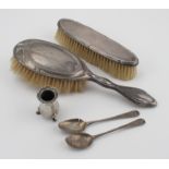 Two silver mounted brushes and Two damaged teaspoons and part of a pepper or salt.