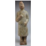 Oriental standing pottery figure of considerable age, 32mm