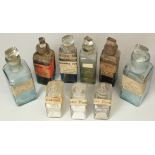 Nine small apothecary bottles with glass stoppers, height 12cm approx. and smaller
