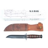 Knife: A US Marine Corps 'KA-BAR' combat knife. Blade 5.25". Ricasso marked 'USMC' and 'KA-BAR' & '