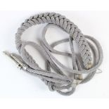 German silver braid officer's Aiguillette for attachment to uniform. Two finial suspension.