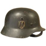 M35 Double Decal helmet. Temple stamp Q62. Liner replaced during lifetime. Named to rear. Remains of