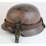 M42 Helmet shell only. No decals. Helmet carrier strap present. Condition relates to long time