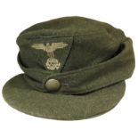 M43 Wool Cap. SS Single material trapezoidal insignia to front. Single button retainer to front.