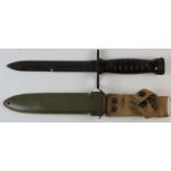 A good U.S. M4 Knife bayonet for the M1 Carbine. Plastic ribbed grips secured by two screws? Blade