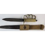 A scarce U.S. WW1 MKI Trench Knuckle Duster fighting knife. Brass grip and knuckles stamped 'U.S.