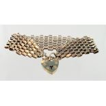 Hallmarked 9ct gold six bar gate bracelet with heart shaped 'padlock' clasp and safety chain.