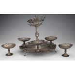 Indian white metal filigree stand raised on three feet, with five matching bonbon dishes, total