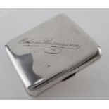 Silver curved cigarette case, hallmarked 'R&S, London 1926' (Reid & Sons, Newcastle on Tyne), gilt