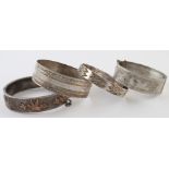 Four silver bangles, various silver marks - one probably Victorian. Weight 2 ¾ oz